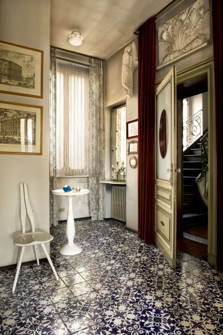 Cascade Vertical Strings An Ornate Tiled Floor Is The Focal Point Of A Grand Antique Entryway