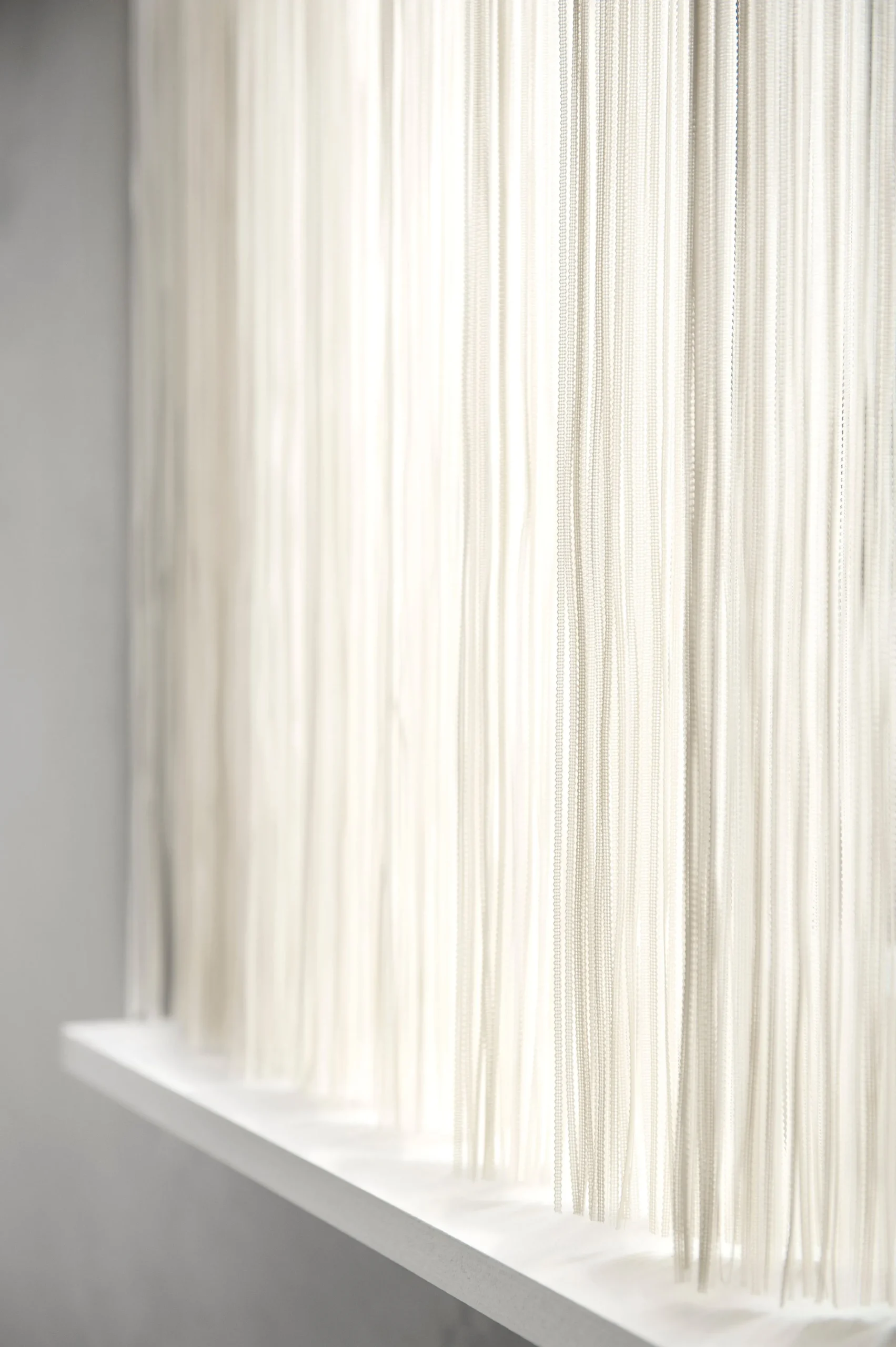Cascade Vertical Strings Sheer, Off White Curtains Hang In A Bright Window