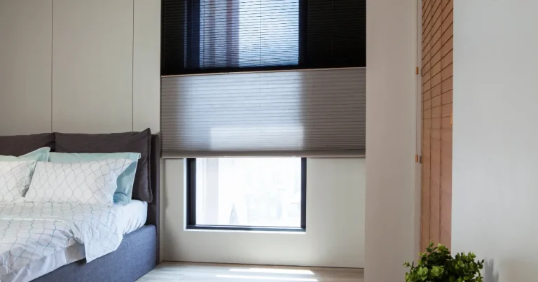 Honeycomb Shades A Bedroom With A Bed And Honeycomb Shades On A Window